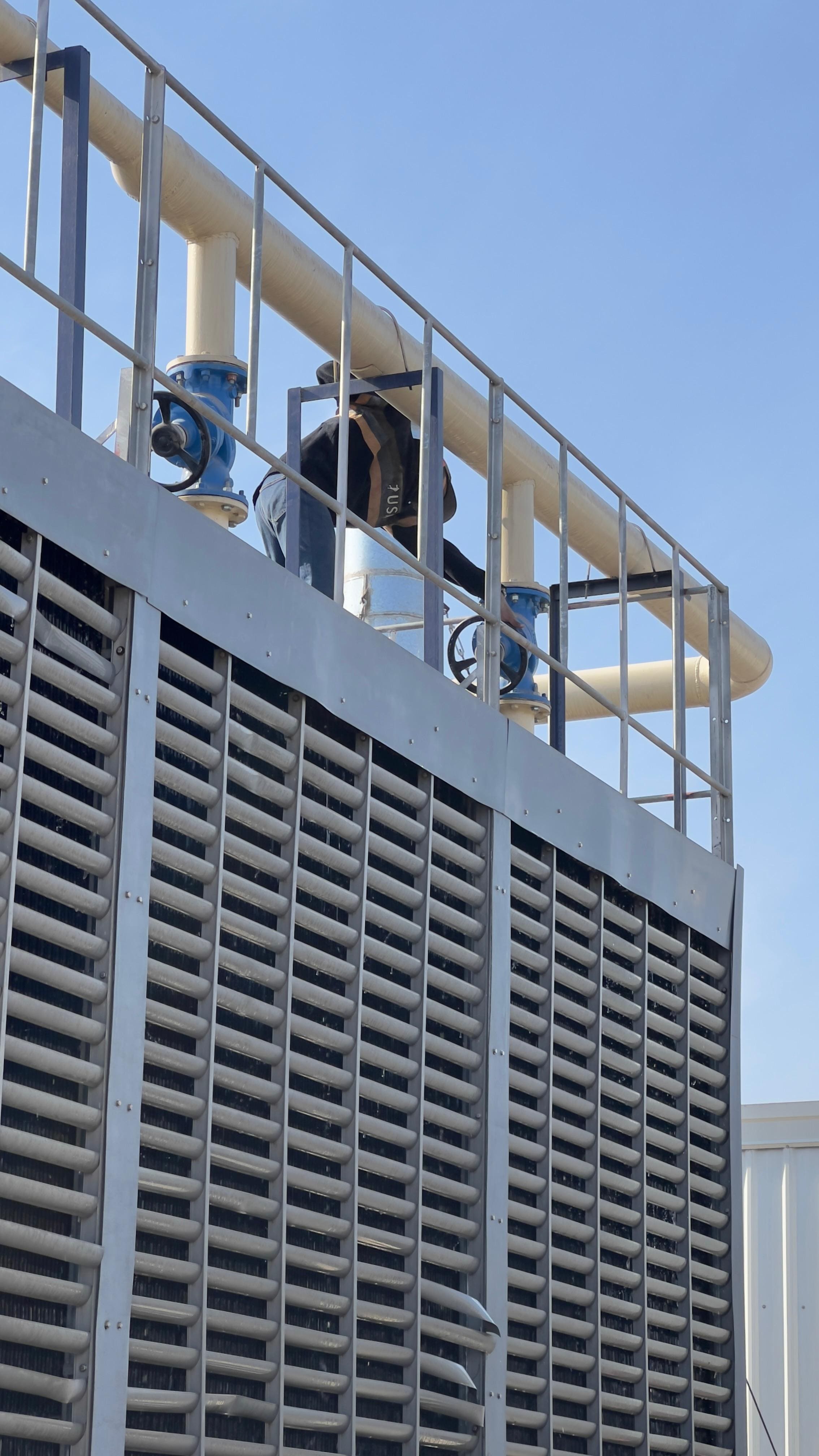 HVAC testing and balancing TAB team measuring airflow at site